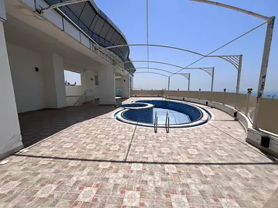 A large, fully furnished rooftop suitable for any commercial or recreational activity, featuring a swimming pool, steam room, two spacious lounges, an