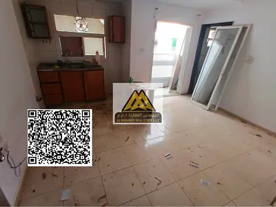 A studio for annual rent in Al Nuaimiya 2 – Ajman, featuring a balcony and a comfortable layout in a prime location close to all services, making it a