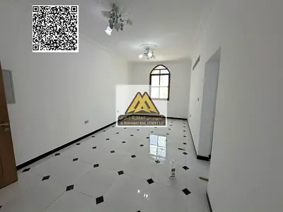 A luxury 2-bedroom apartment with a living room for annual rent in Al Rawda 3 – Ajman, featuring super deluxe finishing, smart card entry system, and