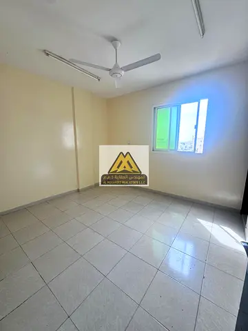 Two-bedroom apartment with a separate living room for annual rent – ​​Two spacious bedrooms, two bathrooms, easy access to Dubai and Sharjah