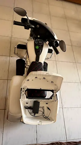 White electric ride-on scooter for kids — used, working with original charge