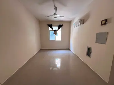 For annual rent in Rawda 3, Ajman - Second studio apartment - Semi-separate kitchen - Split AC - Maintenance included - Suitable for families