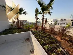 one-bedroom apartment with a living room and a private rooftop in Al Falah