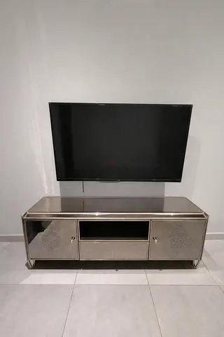 Modern mirrored TV cabinet / media console in silver finish