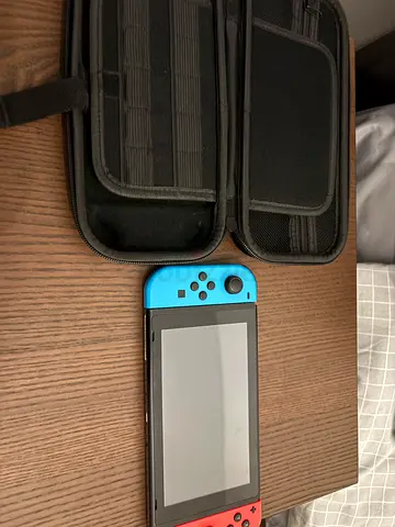 Nintendo Switch 1 including 5 Games , nintendo case holder for nintendo and games and 1 charger