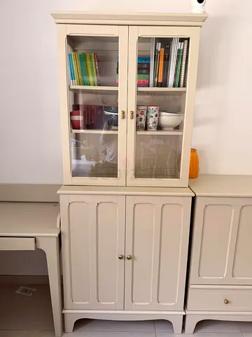 Cream wooden display cabinet with glass doors — good condition - sold in Ikea for AED 1600