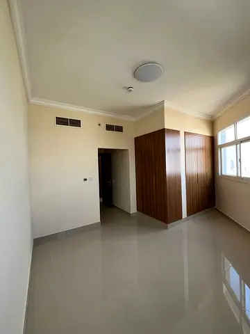 Two bedrooms, a living room, three bathrooms, and a balcony for annual rent