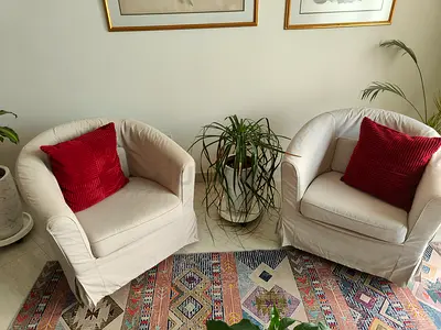Pair of IKEA TULLASTA beige slipcovered armchairs