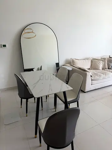Compact modern dining table set with 4 chairs