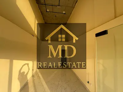 Commercial shops for annual rent in a strategic location on a main street in Al Jurf - various spaces at competitive prices"