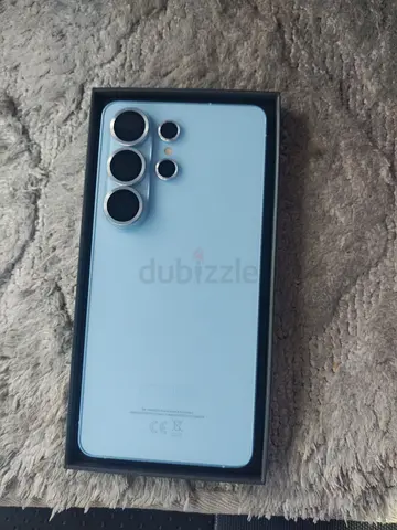 Light blue smartphone with quad camera - like new (in box)