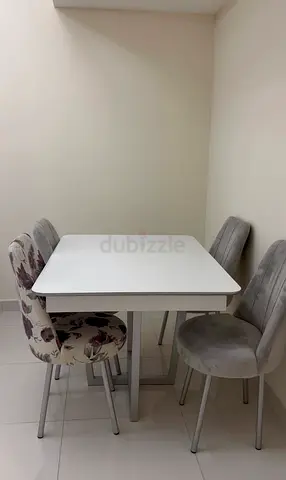 White Dining Table with 4 Upholstered Chairs - Compact Set