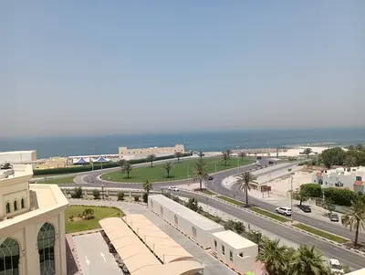 In Al Qulaya area, Sharjah Two bedrooms and a living room Two bathrooms Central air conditioning Large area Balcony Gym Swimming pool Sauna Near Al Sh