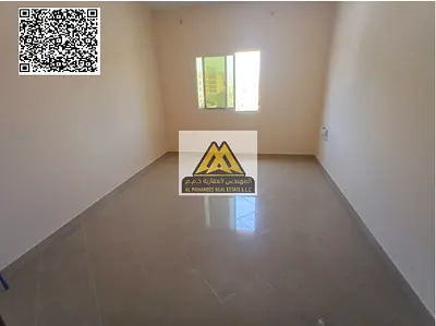 A studio for annual rent in Al Rashidiya 3 – Ajman, featuring a semi-separated kitchen and central