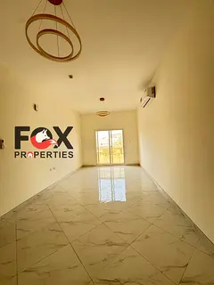 2 bedroom hall apartment for rent in Al Rawda 2 Ajman balcony 2 baths central AC spacious 4 or 6 pay