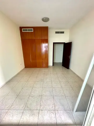 2-bedroom apartment for rent in Al Taawun Sharjah near Al Taawun Roundabout, great location, 2 bathrooms, wardrobes, AC included, gym and pool.