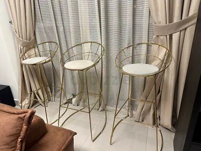 Set of 3 Gold Metal Bar Stools with Cushioned Seats