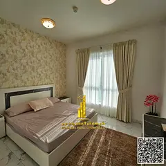 Furnished two-bedroom apartment with a living room for rent in Ajman, Al Rashidiya 1, Oasis Towers.