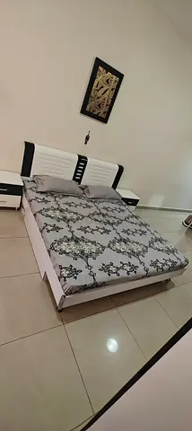 Queen bed frame with headboard mattress, and two bedside tables - good condition