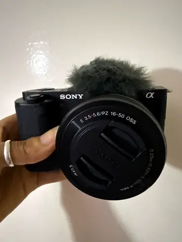 Sony Alpha mirrorless camera with 16-50mm kit lens and external mic