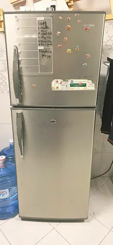Silver Double-Door Refrigerator in Good Working Condition