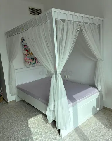 White Canopy Single Bed with Sheer Curtains
