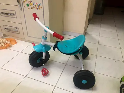 Blue toddler tricycle with wide wheels - good condition