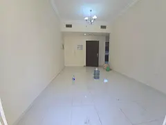 1BHK apartment Emirates City Ajman master room balcony open view free parking AED 28K yearly