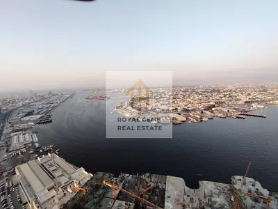 Furnished apartment with two bedrooms and a living room, luxurious hotel-style furnishings.