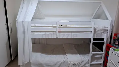 White wooden house-frame bunk bed with ladder — good condition