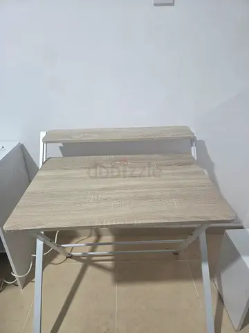 Compact folding study table with light wood top and chair for sale
