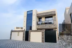 For sale: A luxurious, super deluxe villa in Al Helio, Ajman, with custom finishing and a stone faca