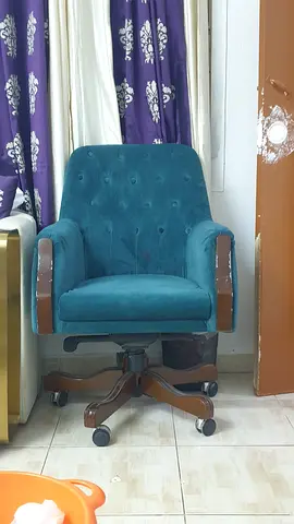 Single teal upholstered swivel armchair with wooden accents — good condition 4 nos