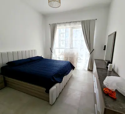 Modern king size upholstered bed frame with mattress and bedside tables - excellent condition