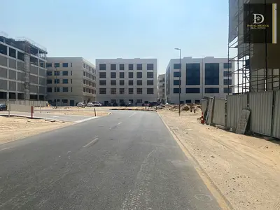 For Sale in Sharjah, Muwaileh Commercial Area (Al Falah Project) Commercial Land Area: 5,000 sq ft On a 24-meter wide road Third plot from the mai