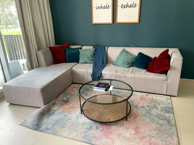 Light green L-shaped fabric sofa - good condition