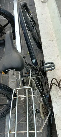 Used black hybrid/commuter bicycle with rear rack