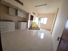 A spacious studio for annual rent in Al Rawda 1 – Ajman, featuring a balcony with an excellent vie