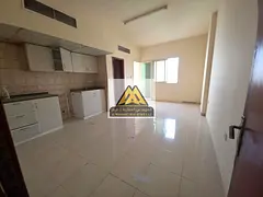 A spacious studio for annual rent in Al Rawda 1 – Ajman, featuring a balcony with an excellent vie