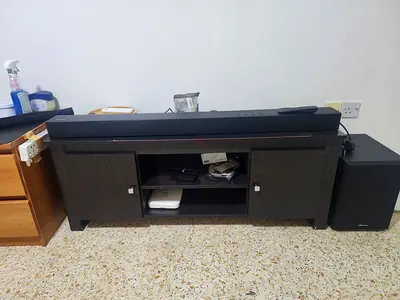 Low TV Entertainment Unit with Subwoofer and Soundbar