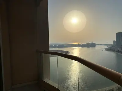 2BR & hall in Sharjah for annual rent | Free AC | Free gym, pool & parking | Built-in wardrobes | Direct sea view