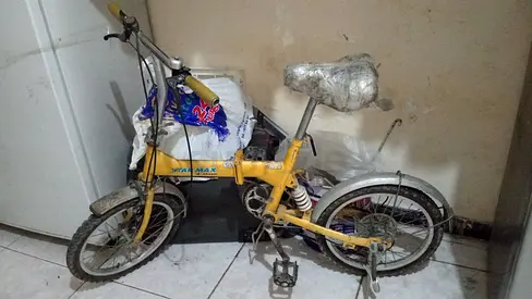 Used small yellow folding/childrens bike - needs minor repairs