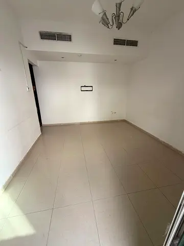 Balcony + built-in wardrobes + free central AC, 1BR + hall for rent in Al Khan, spacious kitchen, prime location near Afamia & Gala Market. 🏡✨