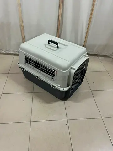SportPet Designs plastic pet transport cage in grey and white