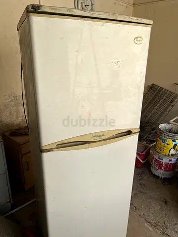 Used single-door refrigerator - functional, needs cosmetic TLC