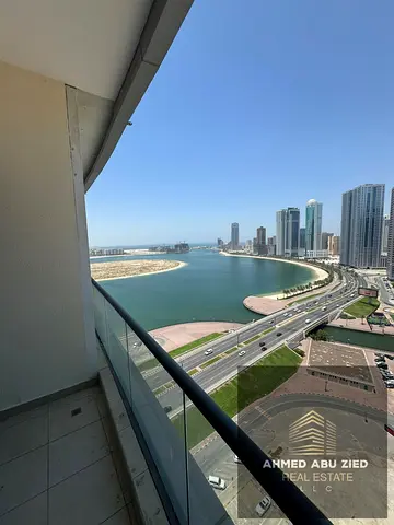 Luxury two-bedroom apartment with maid's room for annual rent in Sharjah, Al Mamzar area | Free AC | Sea view | Gym and swimming pool | Free parking |