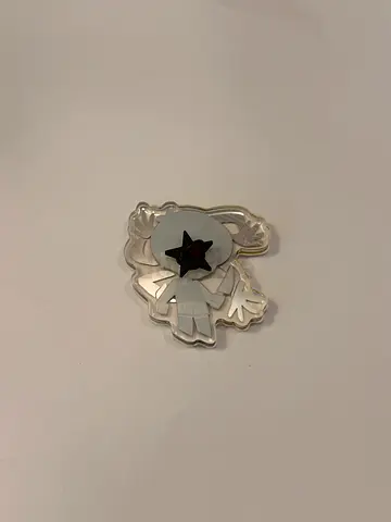 Small decorative acrylic pin/badge with star design
