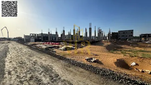 Residential investment land for sale in Al-Haliu with a building permit for a ground floor and two upper floors, including registration fees.