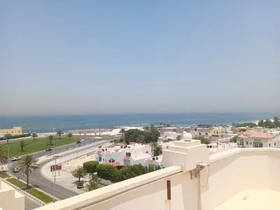 Two rooms and a hall for annual rent in Al Qulayaa, Sharjah. Large space with balcony, gym, swimming pool and sauna. Prime location close to Sharjah C