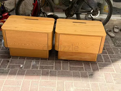 Pair of light oak bedside tables with drawers